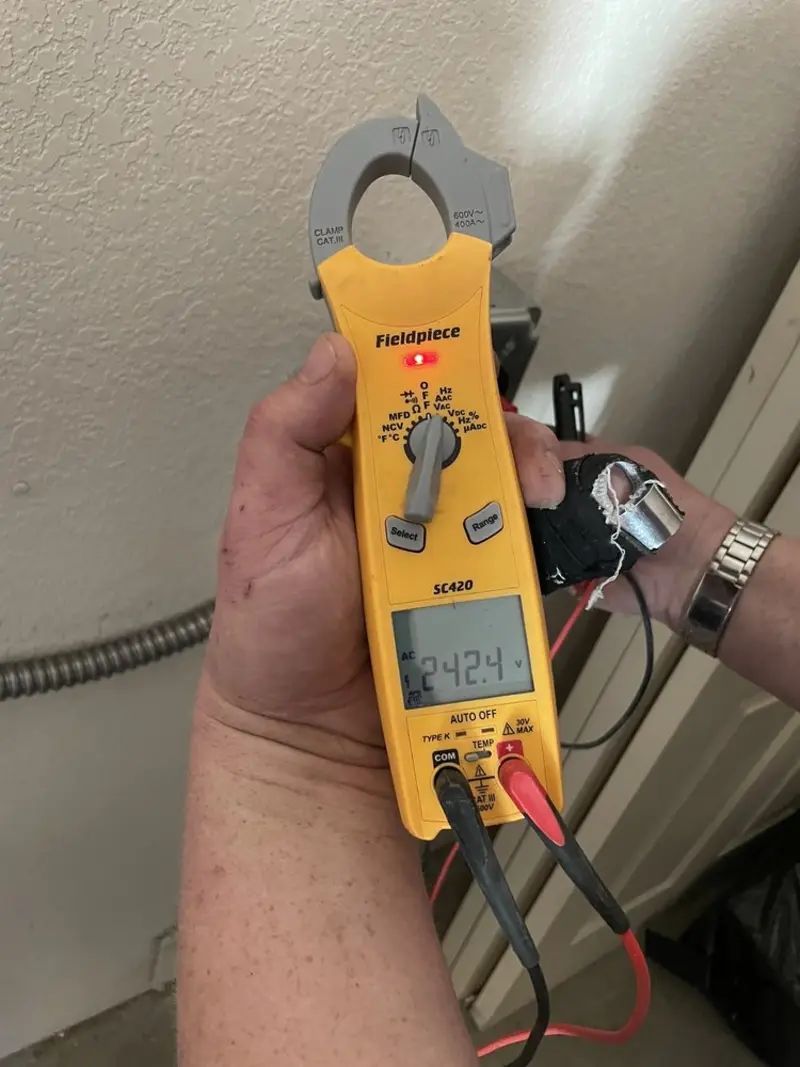 Voltage testing with clamp meter during Outlet Installation in South Weber